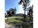 Single story home with a driveway and green lawn at 3110 Siesta Dr, Venice, FL 34293