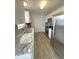 Modern kitchen, granite countertops, stainless steel appliances at 3110 Siesta Dr, Venice, FL 34293