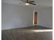 Bright living room with wood-look floors and ceiling fan at 3110 Siesta Dr, Venice, FL 34293