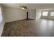 Spacious living room featuring wood-look tile floors at 3110 Siesta Dr, Venice, FL 34293
