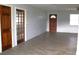 Living area with wood-look tile flooring and entryway at 3110 Siesta Dr, Venice, FL 34293