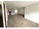 Living room with wood-look tile floors at 3110 Siesta Dr, Venice, FL 34293