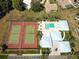 Overhead view of tennis courts, pool, and clubhouse at 3117 Heron Shores Dr, Venice, FL 34293