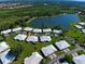 Aerial view showing home's location in a community by a lake at 3117 Heron Shores Dr, Venice, FL 34293