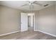 Spacious bedroom with wood-look floors and built-in closet at 3117 Heron Shores Dr, Venice, FL 34293