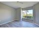 Bedroom with large window and wood-look vinyl flooring at 3117 Heron Shores Dr, Venice, FL 34293