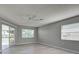 Bedroom with a sliding glass door to a patio at 3117 Heron Shores Dr, Venice, FL 34293