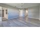 Bright bedroom with wood-look floors and access to a private patio at 3117 Heron Shores Dr, Venice, FL 34293