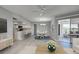 Bright dining area with wood-look floors and access to the back patio at 3117 Heron Shores Dr, Venice, FL 34293