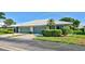 Exterior of a two-car garage villa with a landscaped yard at 3117 Heron Shores Dr, Venice, FL 34293