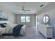 Spacious main bedroom with ceiling fan and sliding door to patio at 3117 Heron Shores Dr, Venice, FL 34293
