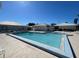 Community pool with surrounding lounge chairs at 3117 Heron Shores Dr, Venice, FL 34293
