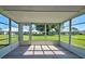 Sunroom with view of backyard and lots of natural light at 3117 Heron Shores Dr, Venice, FL 34293