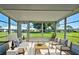 Bright sunroom with furniture and view of the backyard at 3117 Heron Shores Dr, Venice, FL 34293