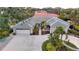 Attractive single-story home with a large driveway and landscaped yard at 315 Park N Blvd, Venice, FL 34285