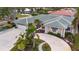 Single-Gathering home with circular driveway and lush landscaping at 315 Park N Blvd, Venice, FL 34285