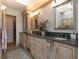 Elegant bathroom with double vanity, granite countertops, and a large soaking tub at 315 Park N Blvd, Venice, FL 34285