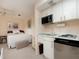 Cozy bedroom with kitchenette and sitting area at 315 Park N Blvd, Venice, FL 34285