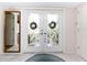 Elegant entry with double doors featuring etched glass and a decorative rug at 315 Park N Blvd, Venice, FL 34285
