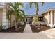 Inviting front entry with lush landscaping and double doors at 315 Park N Blvd, Venice, FL 34285