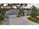 Single-Gathering home with a two-car garage and circular driveway at 315 Park N Blvd, Venice, FL 34285