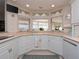 Modern kitchen with white cabinets and corner sink at 315 Park N Blvd, Venice, FL 34285