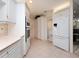 Bright kitchen with white cabinets, double oven, and tile floors at 315 Park N Blvd, Venice, FL 34285