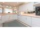 White kitchen with granite countertops and ample cabinet space at 315 Park N Blvd, Venice, FL 34285
