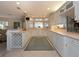 Large kitchen with white cabinets and island at 315 Park N Blvd, Venice, FL 34285