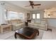 Bright living room with large windows and comfortable sofas at 315 Park N Blvd, Venice, FL 34285