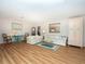 Spacious living room with floral sofas and wood flooring at 315 Park N Blvd, Venice, FL 34285