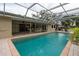 Inviting pool area with covered patio and brick pavers at 315 Park N Blvd, Venice, FL 34285
