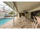 Spacious patio with pool views and seating area for outdoor dining at 315 Park N Blvd, Venice, FL 34285