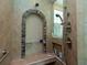 Walk-in shower with arched niche and tiled walls at 315 Park N Blvd, Venice, FL 34285