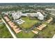 Aerial view of community featuring buildings, landscaping, and parking at 3730 Cadbury Cir # 300, Venice, FL 34293