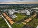 Aerial view of a large community with multiple buildings and landscaped grounds at 3730 Cadbury Cir # 300, Venice, FL 34293