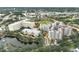 Aerial view showcasing community buildings, landscape, and parking areas at 3730 Cadbury Cir # 300, Venice, FL 34293