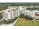 Aerial view of a large apartment building with surrounding green space at 3730 Cadbury Cir # 300, Venice, FL 34293