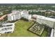 Aerial view showing community with building, green space, and parking at 3730 Cadbury Cir # 300, Venice, FL 34293