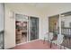 Screened balcony with two chairs and views of surrounding buildings at 3730 Cadbury Cir # 300, Venice, FL 34293