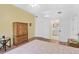 Bedroom with ensuite bathroom, hardwood floors and wooden cabinet at 3730 Cadbury Cir # 300, Venice, FL 34293