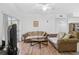 Living room with hardwood floors, two sofas, and a coffee table at 3730 Cadbury Cir # 300, Venice, FL 34293