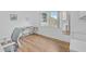 Home office with large window, hardwood floors, and modern desk at 3730 Cadbury Cir # 300, Venice, FL 34293