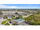 Community pool and surrounding area, with houses and a lake in the background at 3789 Lakewood Blvd, North Port, FL 34287