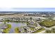 Aerial view of community with lake and homes at 3789 Lakewood Blvd, North Port, FL 34287