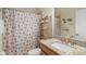 Charming bathroom with seashell shower curtain and granite vanity at 3789 Lakewood Blvd, North Port, FL 34287