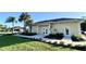 Community clubhouse with landscaping and parking at 3789 Lakewood Blvd, North Port, FL 34287