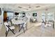 Bright community room with tables and chairs at 3789 Lakewood Blvd, North Port, FL 34287