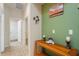 Clean hallway with light walls and wooden console table at 3789 Lakewood Blvd, North Port, FL 34287