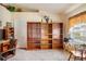 Home office features built-in shelving, a desk, and comfortable seating at 3789 Lakewood Blvd, North Port, FL 34287